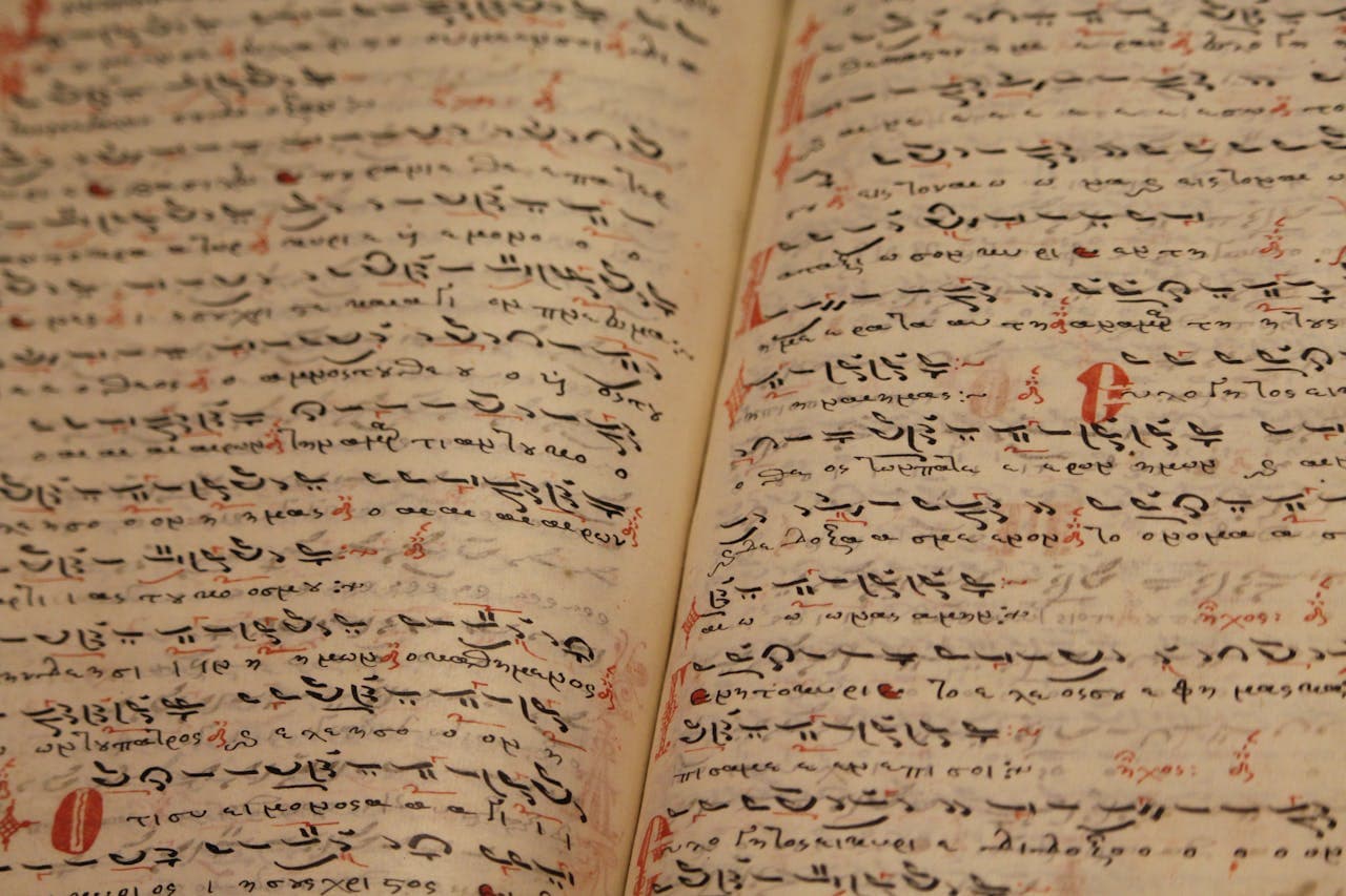 An open book with containing Arabic on the pages
